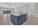 Modern kitchen island with stainless steel appliances and a large window overlooking the waterfront at 1327 Wesley Dr, Punta Gorda, FL 33950