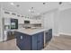 Kitchen featuring a large island, stainless steel appliances, white cabinets, and a wine cooler at 1327 Wesley Dr, Punta Gorda, FL 33950
