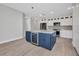 Spacious kitchen island with wine cooler, stainless appliances, and custom white cabinetry at 1327 Wesley Dr, Punta Gorda, FL 33950