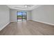 Comfortable living room with tile floors, ceiling fan, and large sliding glass doors with a waterfront view at 1327 Wesley Dr, Punta Gorda, FL 33950