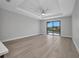 Spacious living room with ceiling fan, tile floors, and sliding glass doors leading to the waterfront at 1327 Wesley Dr, Punta Gorda, FL 33950