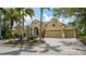 Stunning home featuring a manicured front yard, beautiful landscaping and a circular driveway at 13616 Legends Walk Ter, Lakewood Ranch, FL 34202