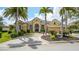 Stunning home featuring a manicured front yard, beautiful landscaping and a circular driveway at 13616 Legends Walk Ter, Lakewood Ranch, FL 34202