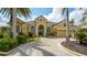 Stunning home featuring a manicured front yard, beautiful landscaping and a circular driveway at 13616 Legends Walk Ter, Lakewood Ranch, FL 34202