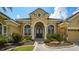 Charming home featuring a manicured front yard, beautiful landscaping and a brick walkway at 13616 Legends Walk Ter, Lakewood Ranch, FL 34202