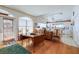 The dining room has hardwood floors, large window for light and view and access to kitchen at 145 Burns Rd, Terra Ceia, FL 34250