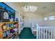 Upstairs hallway featuring built-in bookshelves and a skylight at 145 Burns Rd, Terra Ceia, FL 34250