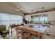 Kitchen with an eat in table area, lots of windows for natural light and light colored cabinets at 145 Burns Rd, Terra Ceia, FL 34250