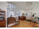 Living room with stairway to second floor, hard wood floors, lots of windows, and natural light at 145 Burns Rd, Terra Ceia, FL 34250