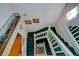 Carpeted staircase with white railings at 145 Burns Rd, Terra Ceia, FL 34250
