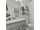 Stylish bathroom featuring a modern vanity, decorative shelves, and elegant fixtures at 2930 61St E Dr, Ellenton, FL 34222