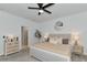 Charming bedroom with dresser, ceiling fan, and ensuite bathroom at 2930 61St E Dr, Ellenton, FL 34222