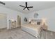 Spacious bedroom with a ceiling fan, accent lighting, and a dressing area at 2930 61St E Dr, Ellenton, FL 34222