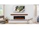 Stylish fireplace with wooden mantel, shiplap accent wall, and decorative accents at 2930 61St E Dr, Ellenton, FL 34222