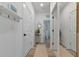 Bright hallway with wood floors, storage, and an open view into other rooms at 2930 61St E Dr, Ellenton, FL 34222