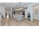 Spacious kitchen with gray cabinetry, quartz countertops, stainless steel appliances, and pendant lighting at 2930 61St E Dr, Ellenton, FL 34222