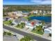 Aerial view of a lakeside residential area with modern homes, mature trees, and well-maintained landscaping at 3325 Azurite Way, Bradenton, FL 34211