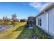 Backyard featuring a view of the screened in lanai and lovely lake view at 3325 Azurite Way, Bradenton, FL 34211