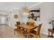 Dining room featuring an elegant chandelier, a long table, and bench seating at 3325 Azurite Way, Bradenton, FL 34211