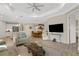 Open-concept living space with a view of the kitchen, dining area, and access to other rooms at 3325 Azurite Way, Bradenton, FL 34211