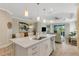 Bright, open living area with a large island, pendant lighting, and seamless access to the dining and living spaces at 3325 Azurite Way, Bradenton, FL 34211