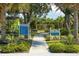 The tranquil park, surrounded by lush landscaping and trees, includes playground equipment at 3325 Azurite Way, Bradenton, FL 34211