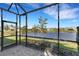 Screened-in patio with a serene lake view at 3325 Azurite Way, Bradenton, FL 34211