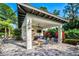 Outdoor pavilion with ceiling fans, a built-in grill, a television, and ample seating for gatherings at 3325 Azurite Way, Bradenton, FL 34211