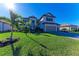 Well-manicured front lawn and a three-car garage complement this two-story home at 4852 Coastal Days Ln, Bradenton, FL 34211