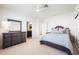 Bright bedroom with an ensuite bathroom and large dresser with a decorative mirror at 1023 Tocobaga Ln, Sarasota, FL 34236