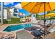 Inviting pool with lounge chairs and umbrella, perfect for relaxation in the sun at 1023 Tocobaga Ln, Sarasota, FL 34236