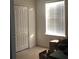 Bright bedroom with a large closet, neutral walls, and natural light from the window at 15079 Wichita Rd, Port Charlotte, FL 33981
