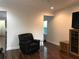 Cozy living area with hardwood floors, recessed lighting, and a comfortable armchair at 15079 Wichita Rd, Port Charlotte, FL 33981