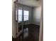 Bright office featuring hardwood floors, neutral walls, and natural light from the window at 15079 Wichita Rd, Port Charlotte, FL 33981