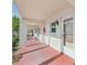 A long outdoor hallway showing unit 120 with a red painted floor at 250 Santa Maria St # 120, Venice, FL 34285