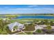 Breathtaking aerial view showcasing the golf course, lake, and clubhouse in a vibrant community setting at 3016 Formia Ct, Bradenton, FL 34211