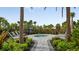 Community hot tub surrounded by lush landscaping and palm trees at 3016 Formia Ct, Bradenton, FL 34211
