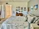 Comfortable bedroom features a cozy bed, wall decor, and a convenient closet, creating a relaxing retreat at 3500 El Conquistador Pkwy # 119, Bradenton, FL 34210