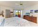 Bright bedroom with a sliding door to a covered patio area at 3500 El Conquistador Pkwy # 119, Bradenton, FL 34210