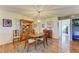 Charming dining room featuring a decorative rug and an elegant light fixture at 3500 El Conquistador Pkwy # 119, Bradenton, FL 34210