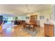 Open concept dining room that opens to a living room with hardwood floors at 3500 El Conquistador Pkwy # 119, Bradenton, FL 34210