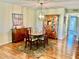 Elegant dining room with classic furnishings and a view of flamingo artwork at 3500 El Conquistador Pkwy # 119, Bradenton, FL 34210
