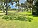 Scenic golf course view with lush green fairways and mature trees, offering a tranquil and picturesque setting at 3500 El Conquistador Pkwy # 119, Bradenton, FL 34210