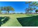 Expansive lawn with mature trees in a well-maintained community at 3500 El Conquistador Pkwy # 119, Bradenton, FL 34210