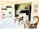 Comfortable living area with ample seating and a view into the adjacent sitting area at 3500 El Conquistador Pkwy # 119, Bradenton, FL 34210
