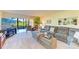 Cozy living room area with comfortable seating and sliding door access to exterior at 3500 El Conquistador Pkwy # 119, Bradenton, FL 34210