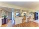 Bright living area boasts hardwood floors, bar seating, and an open concept to the kitchen at 3500 El Conquistador Pkwy # 119, Bradenton, FL 34210