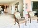 Cozy living room featuring stylish armchairs and a view of the interior space at 3500 El Conquistador Pkwy # 119, Bradenton, FL 34210