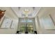 Elegant chandelier fixture highlights the high ceilings at 5341 Greenbrook Dr, Sarasota, FL 34238