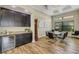 Modern dining area features a sleek table, chairs, and a built-in wine cooler at 5341 Greenbrook Dr, Sarasota, FL 34238